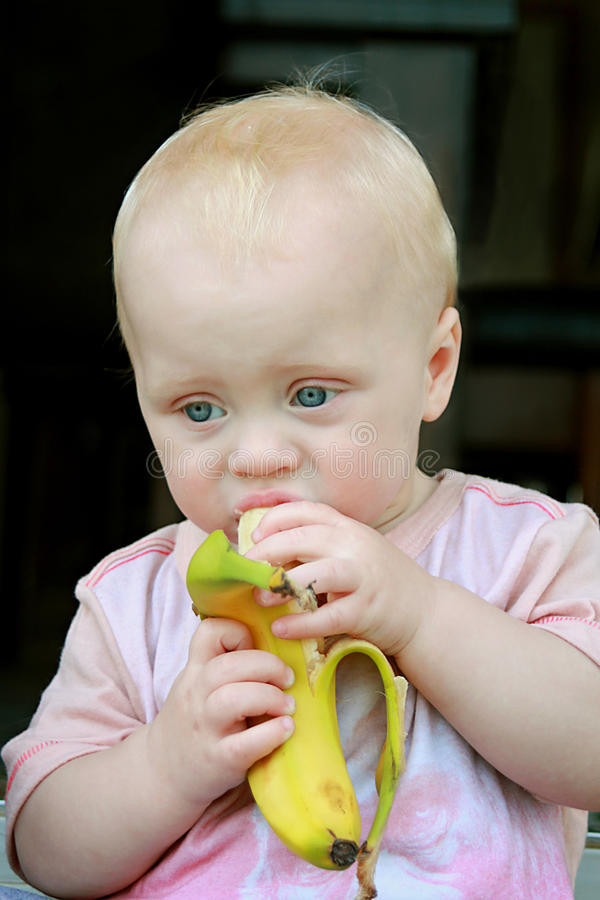 Baby Eating Hair
 Baby Eating Banana stock image Image of pink hair snack