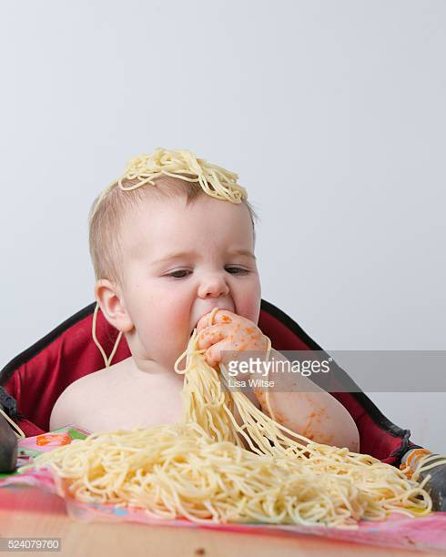Baby Eating Hair
 Angel Hair Pasta Stock s and