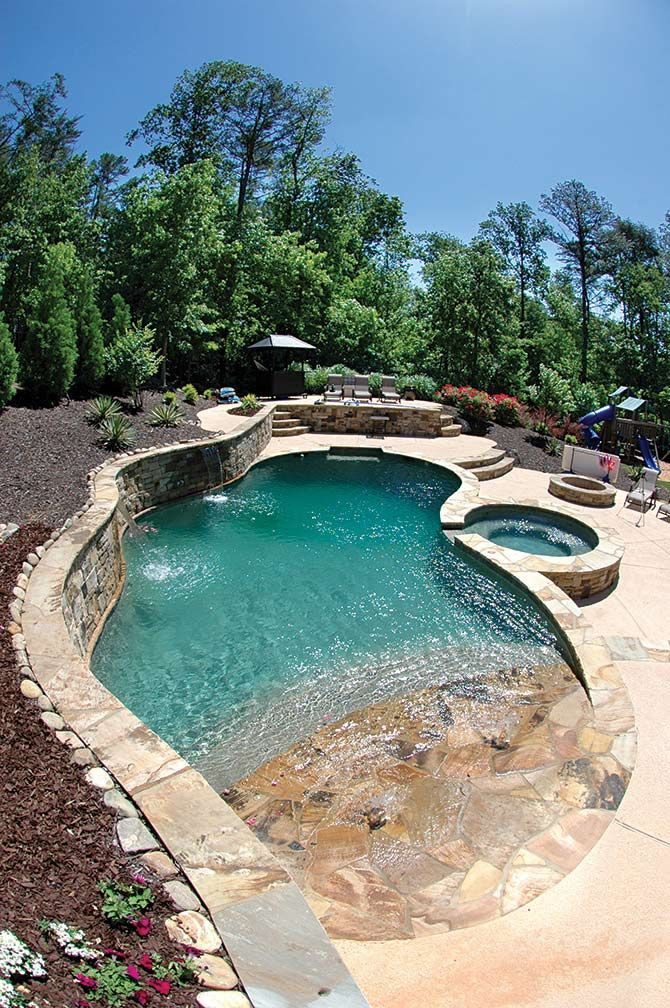 Backyard Beach Pool
 16 ’x 37’ freeform concrete pool with an 8’ round spa and