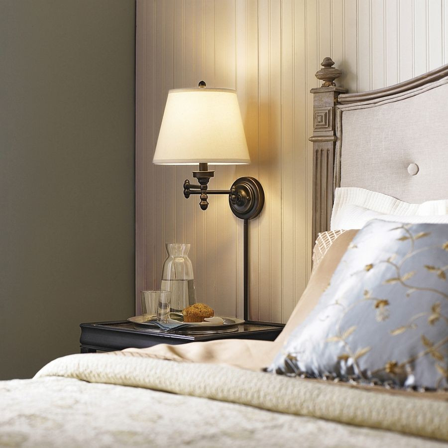 Bedroom Wall Lamp
 Conserve valuable bedside table space by installing a chic