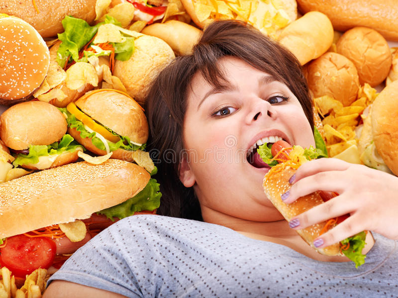 Can Diabetics Eat Hot Dogs
 Woman eating hot dog stock photo Image of body obese
