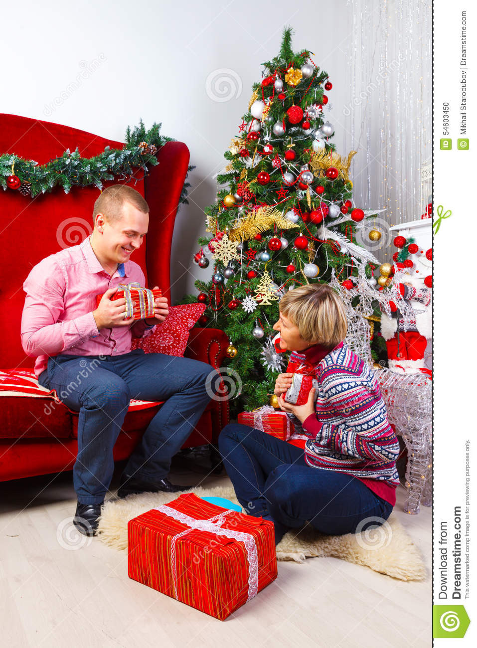 Christmas Gift Ideas Young Couple
 Happy Young Couple With Gifts At New Year Stock
