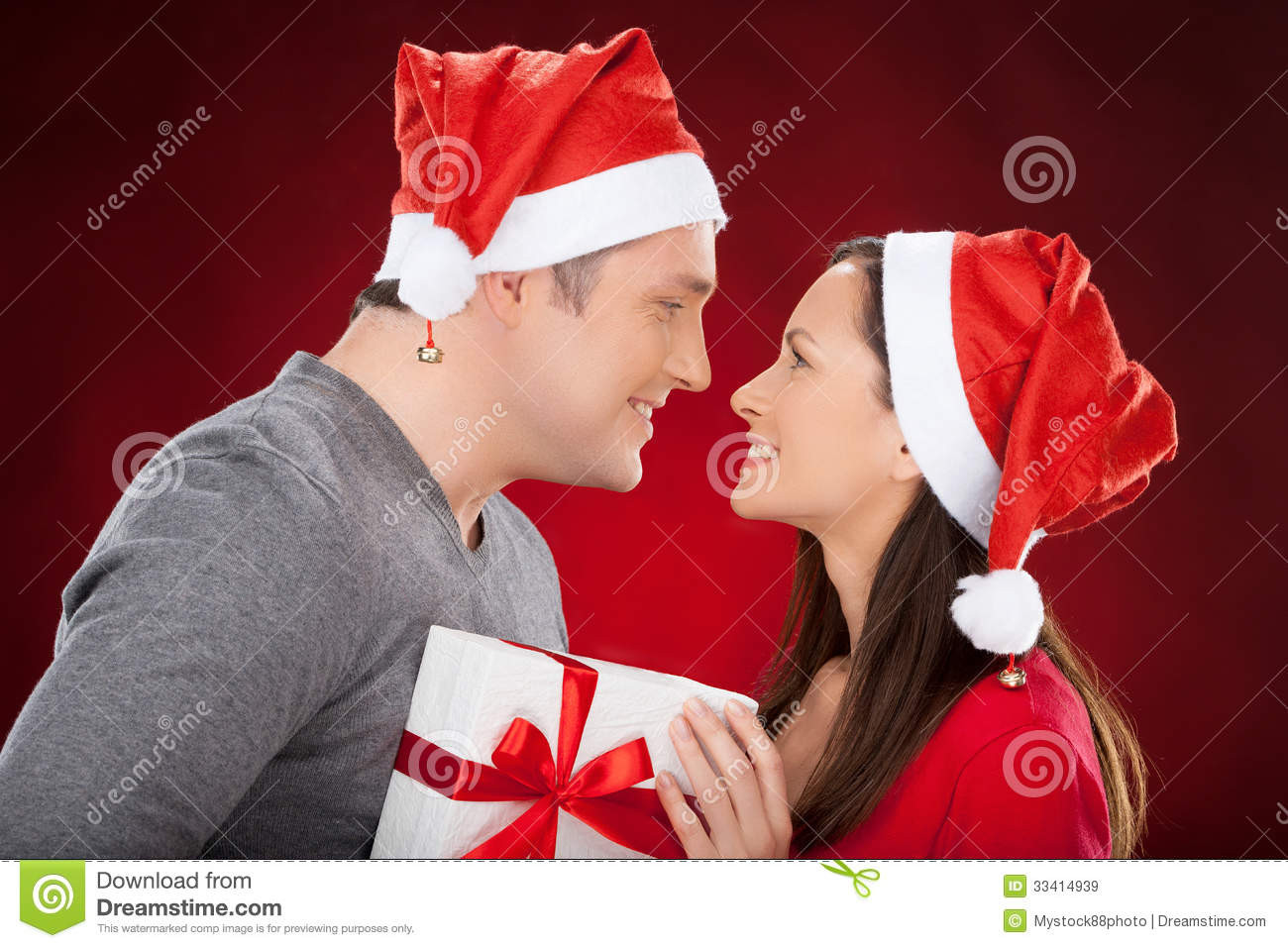Christmas Gift Ideas Young Couple
 To her At Christmas Eve Royalty Free Stock