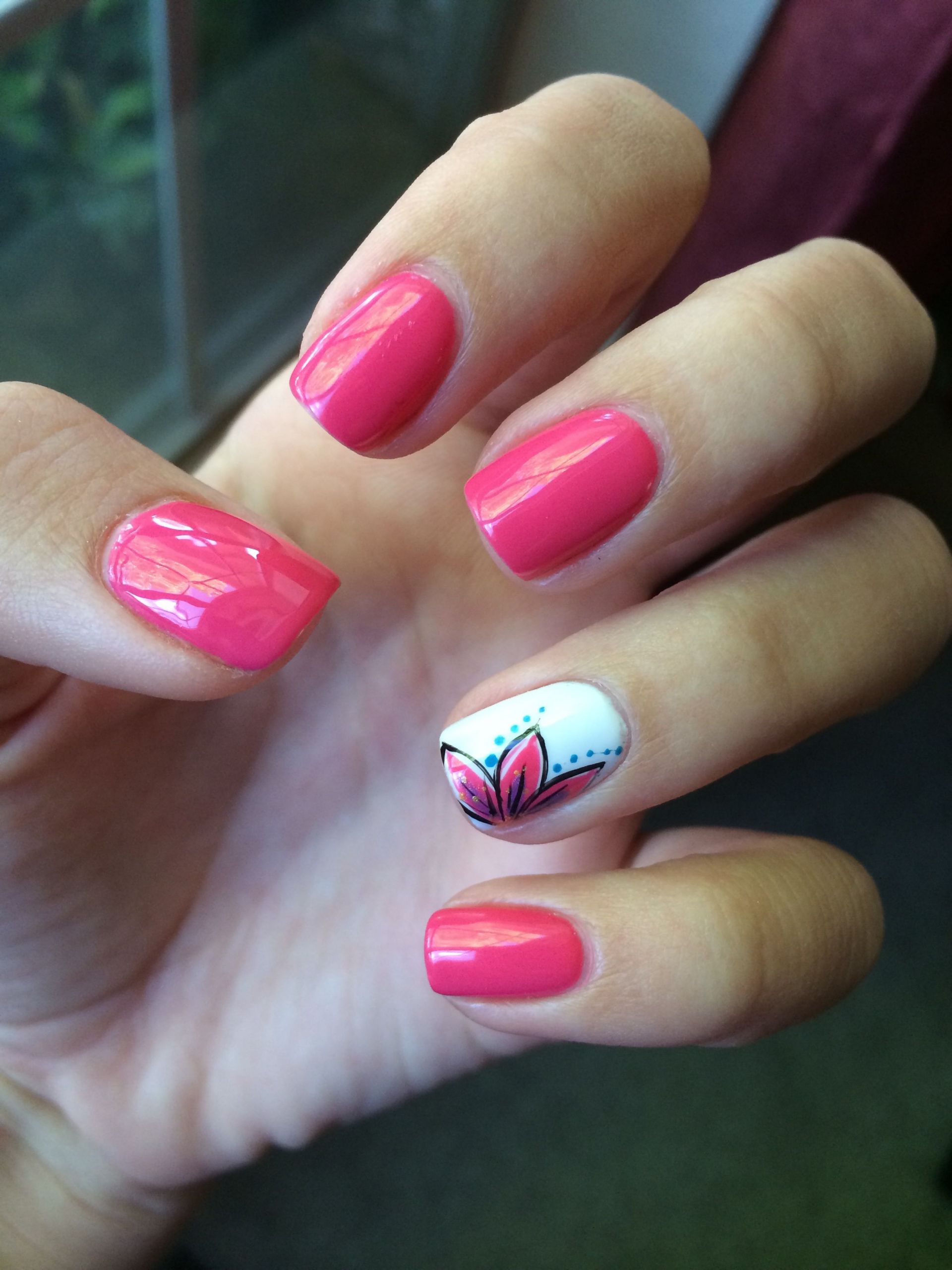 Finger Nail Styles
 Pink nails with a white ring finger that has a flower