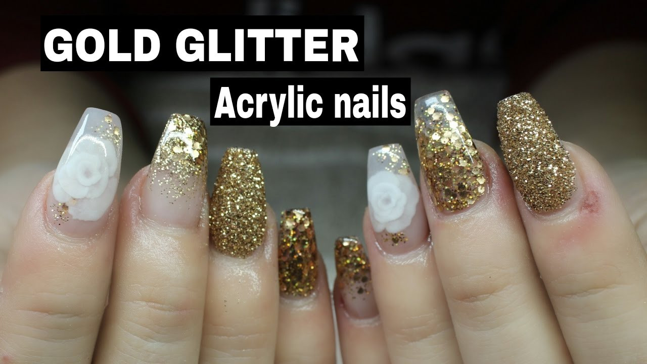 Gold Glitter Coffin Nails
 COFFIN SHAPED ACRYLIC NAILS WITH GOLD GLITTER AND 3D