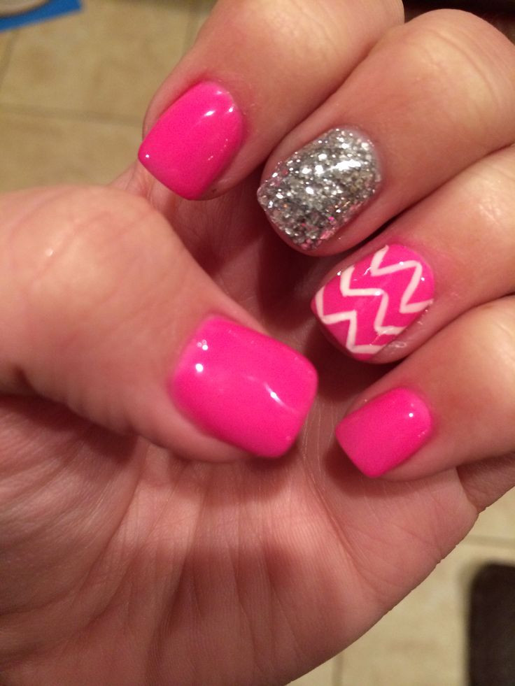 Hot Pink Nails With Glitter
 White chevron and hot pink nails with a glitter accent