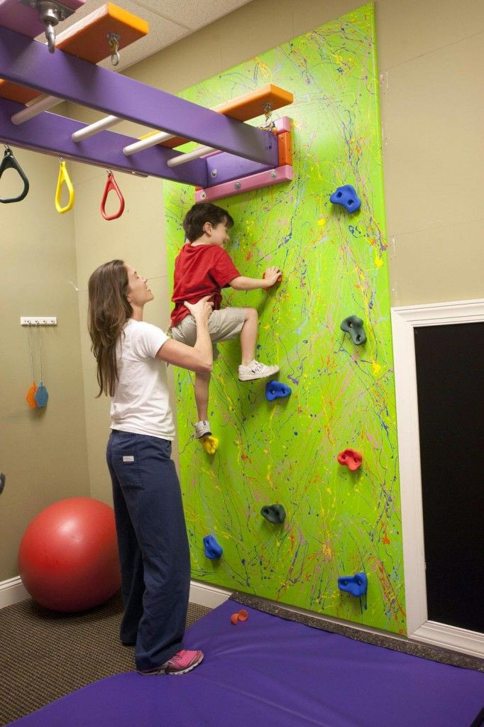 Indoor Monkey Bars Kids
 A climbing wall with monkey bars above