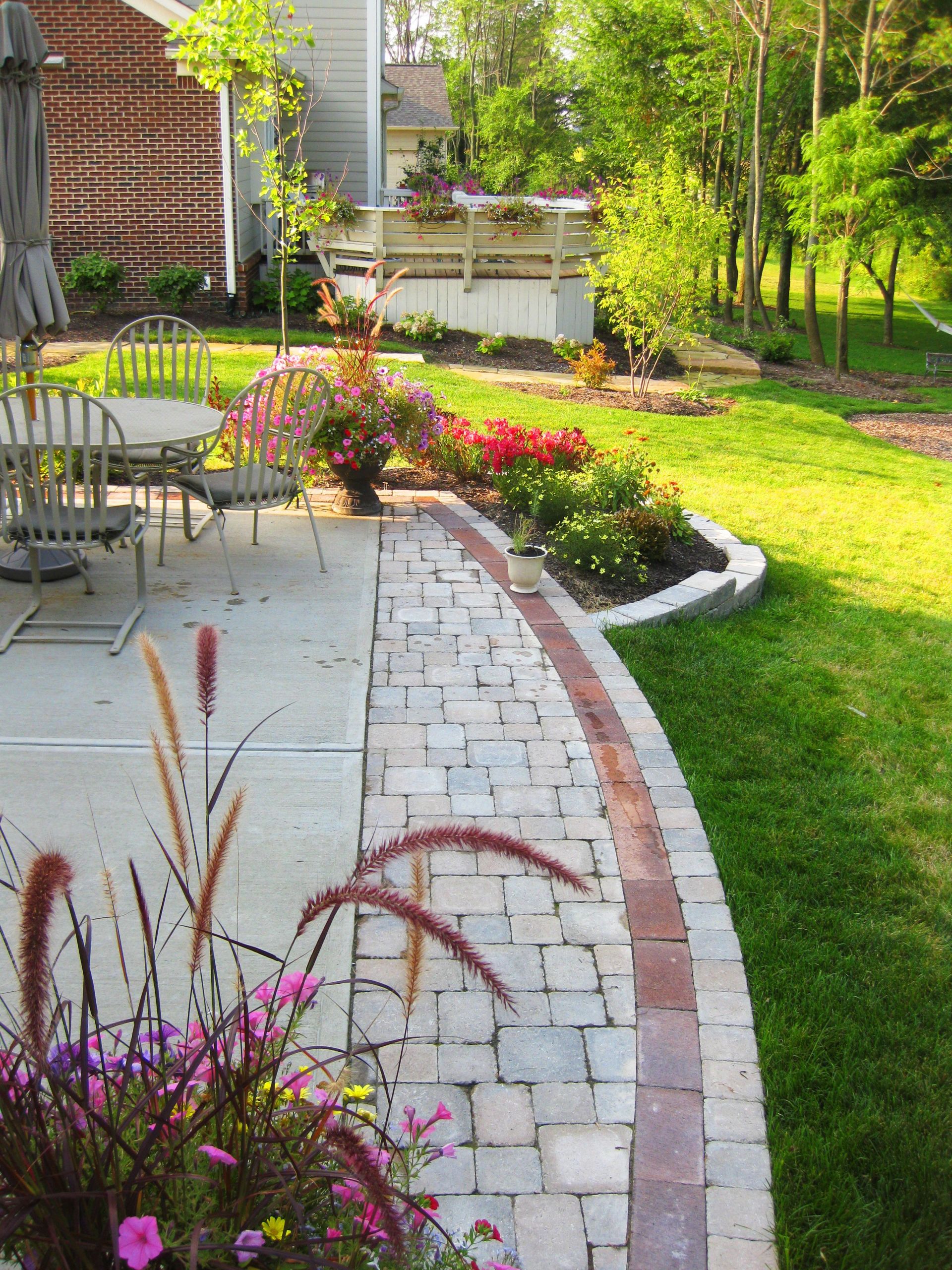 Landscaping Around Concrete Patio
 Stones and pavers to extend the patio Landscape