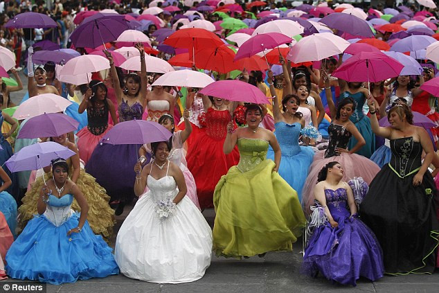 Mexican 15th Birthday Party
 Quinceanera dresses on display as hundreds of teenage