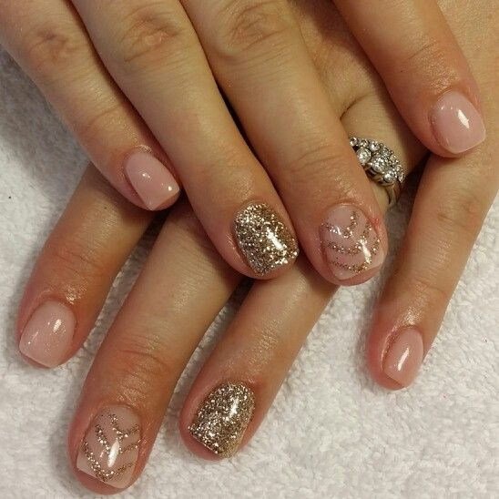 Nude Nails With Gold Glitter
 Nude pink gel nails with gold glitter