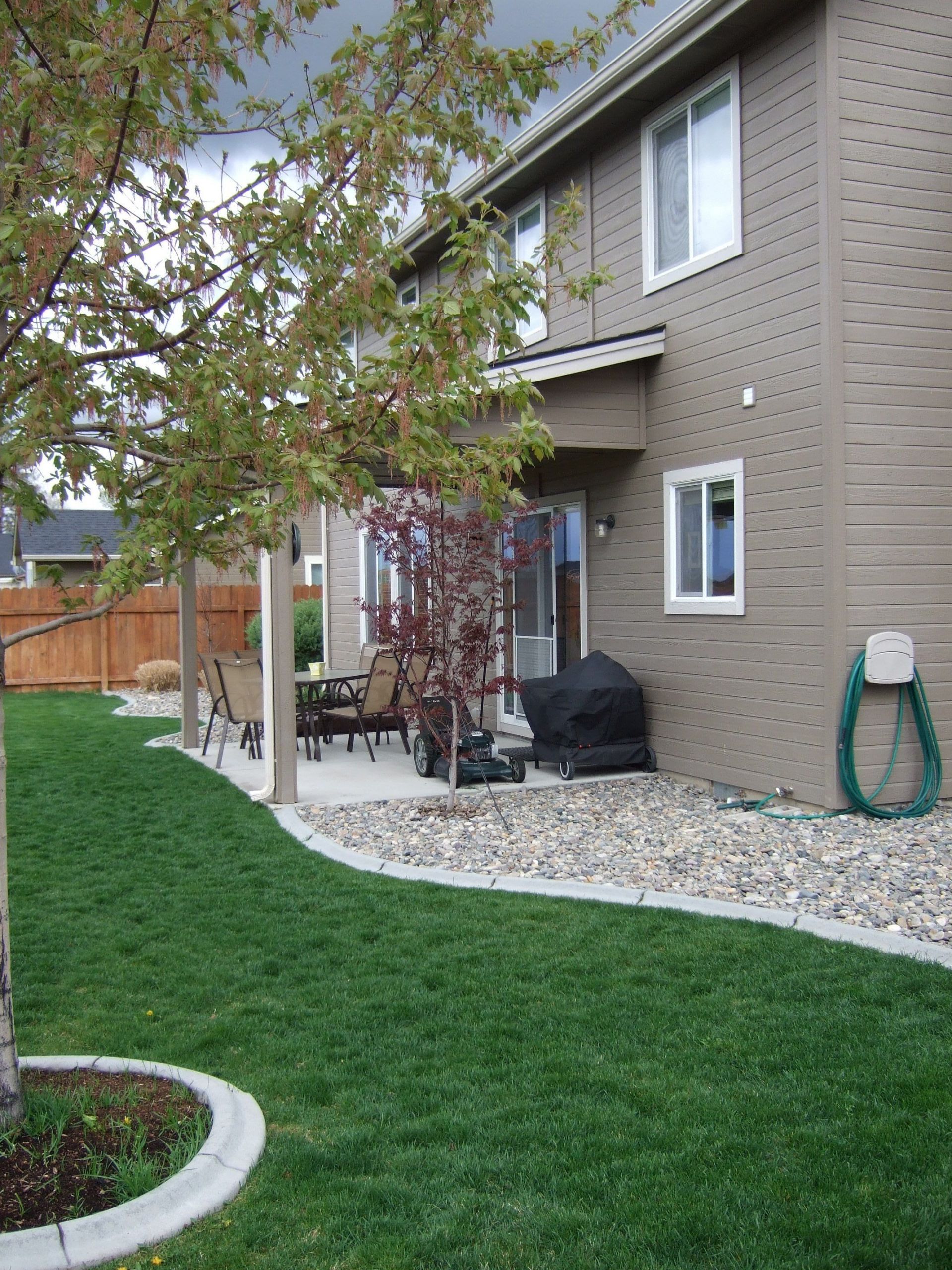 Outdoor Landscape Around House
 Rocks against your house instead of mulch keeps moisture