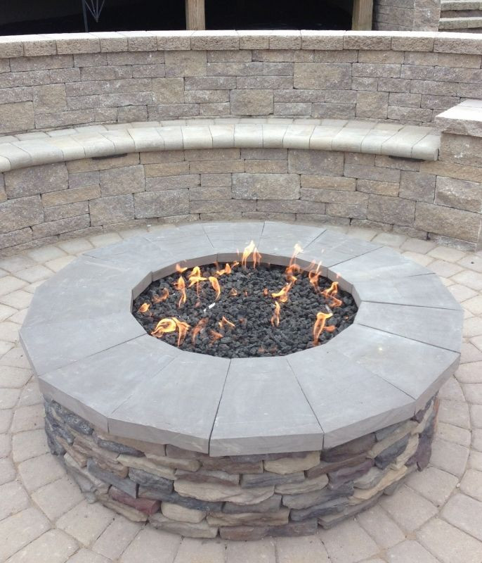 Outdoor Patio Gas Fire Pit
 Gas firepit with stone veneer and natural stone caps