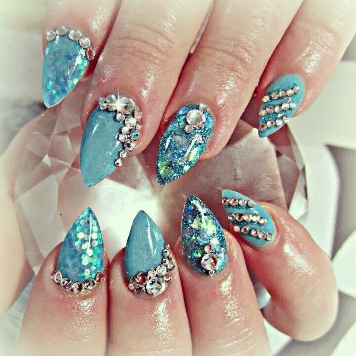 Swarovski Nail Designs
 Shiny blue acrylic nails and swarovski crystals