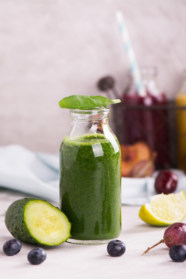 Sweet Green Smoothies
 Healthy sweet green smoothie in a small glass bottle