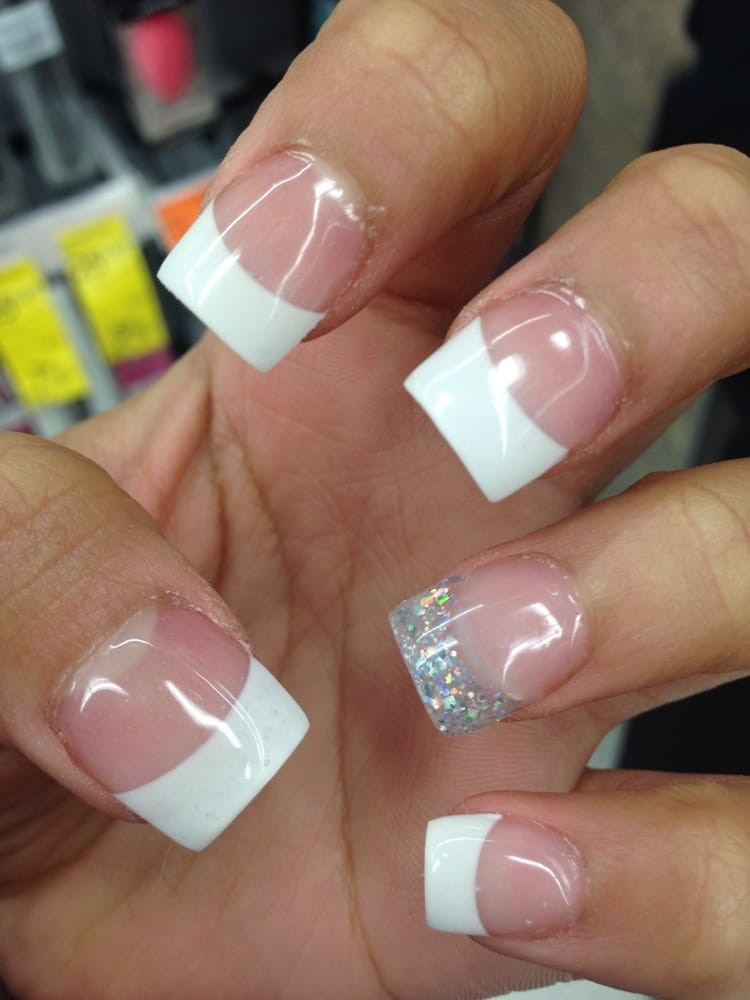 White Glitter Tip Nails
 White tips with one glitter tip $30 with student discount