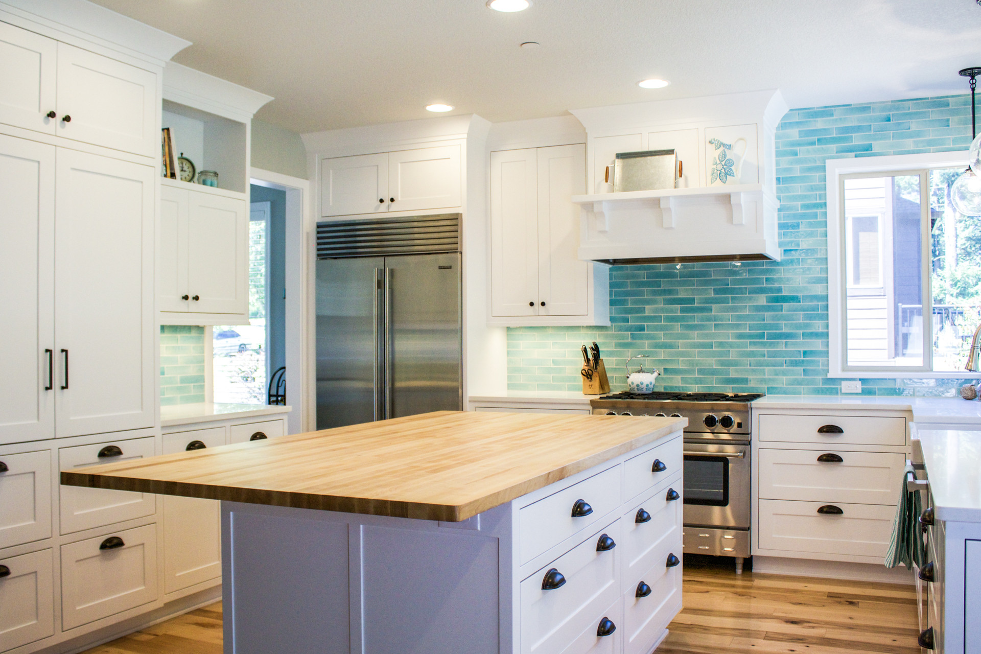 White Kitchen Blue Backsplash
 Custom designed kitchen with white cabinets and bold blue