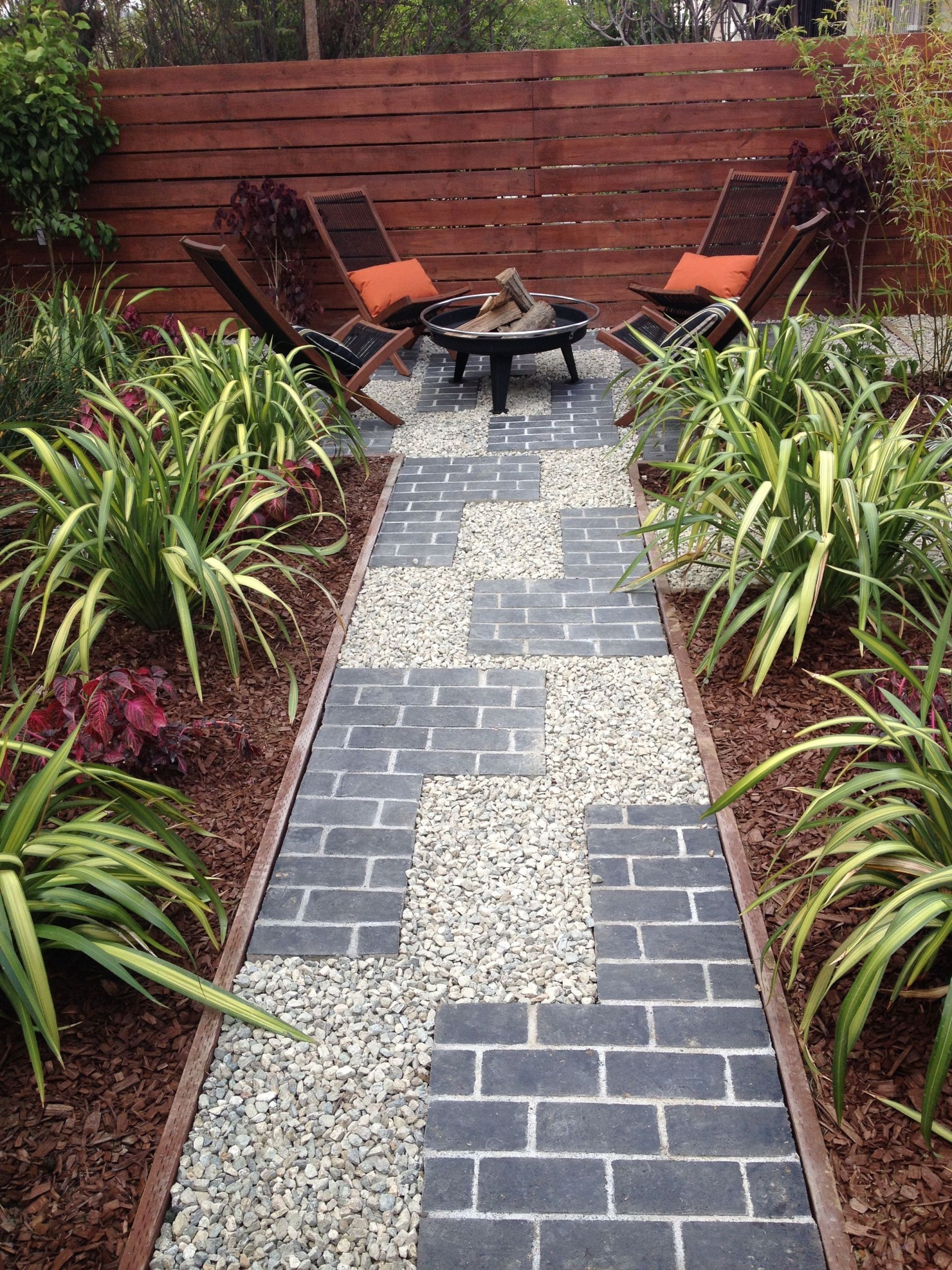 Wood Landscape Edging
 Tetris inspired pathway with grey brick and gravel