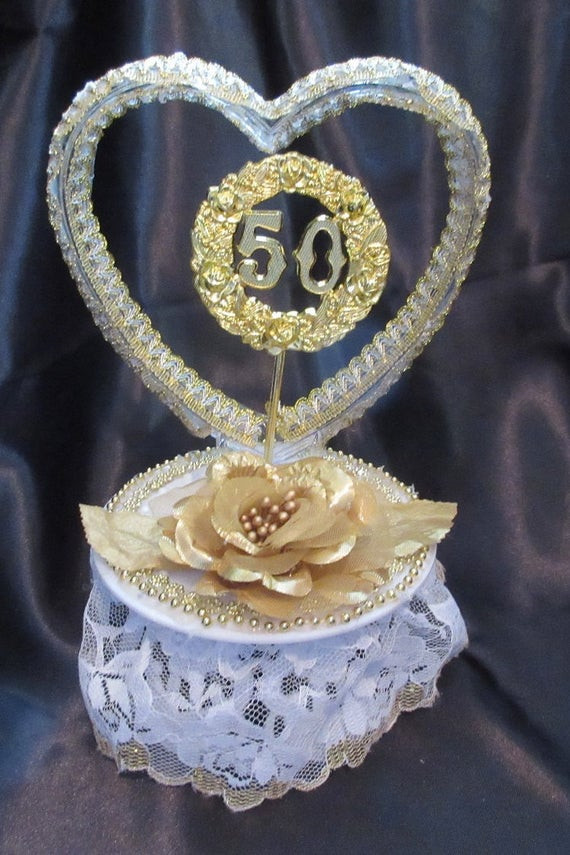 50th Wedding Anniversary Cake Topper
 Golden 50th Wedding Anniversary cake topper by 1topper on Etsy