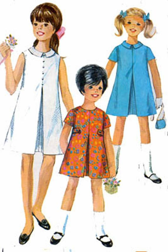 60S Kids Fashion
 1960s Simplicity 7112 Girls MOD A Line Dress with Front