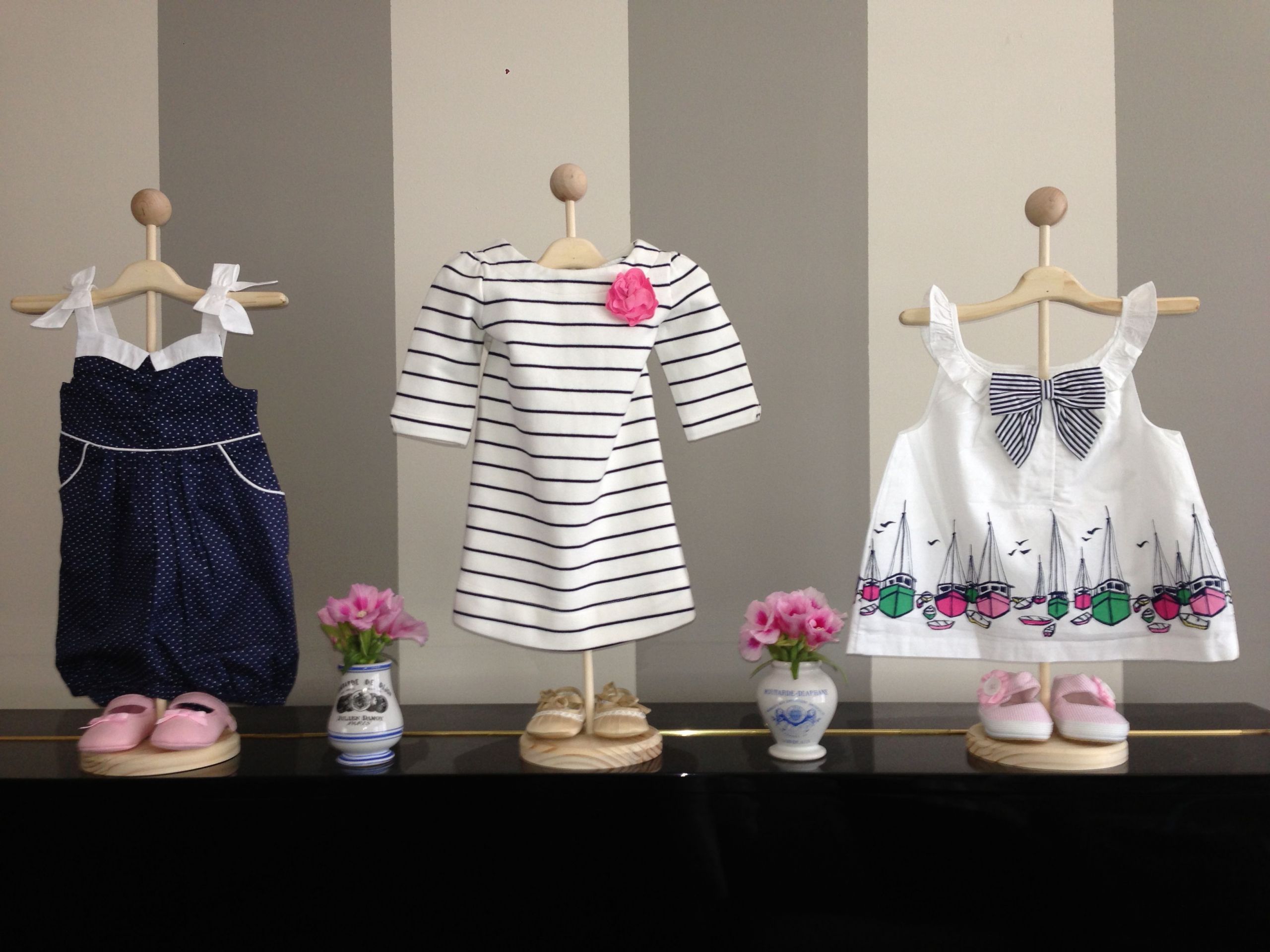 Baby Decor Stores
 Use stands to display baby clothes for cute decorations