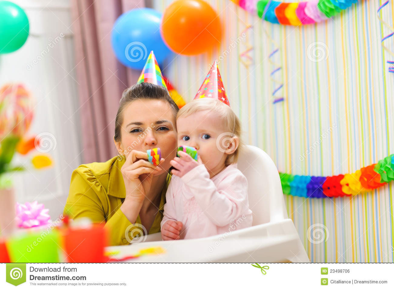 Baby Scared By Party Blower
 Baby And Mother Blowing Into Party Horn Royalty Free Stock
