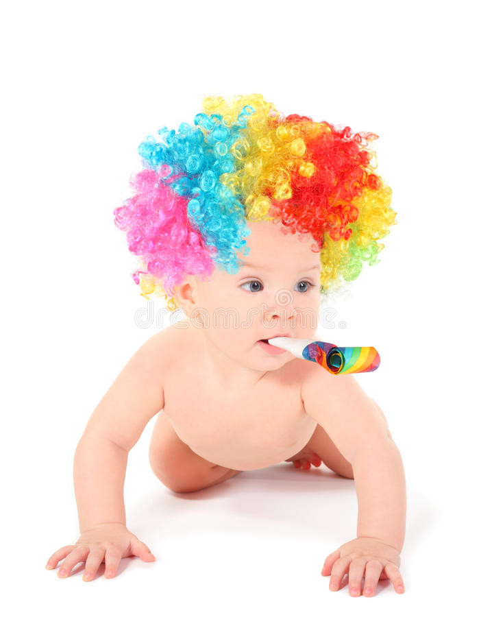 Baby Scared By Party Blower
 Baby Clown With Mulicolored Wig And Party Blower Stock