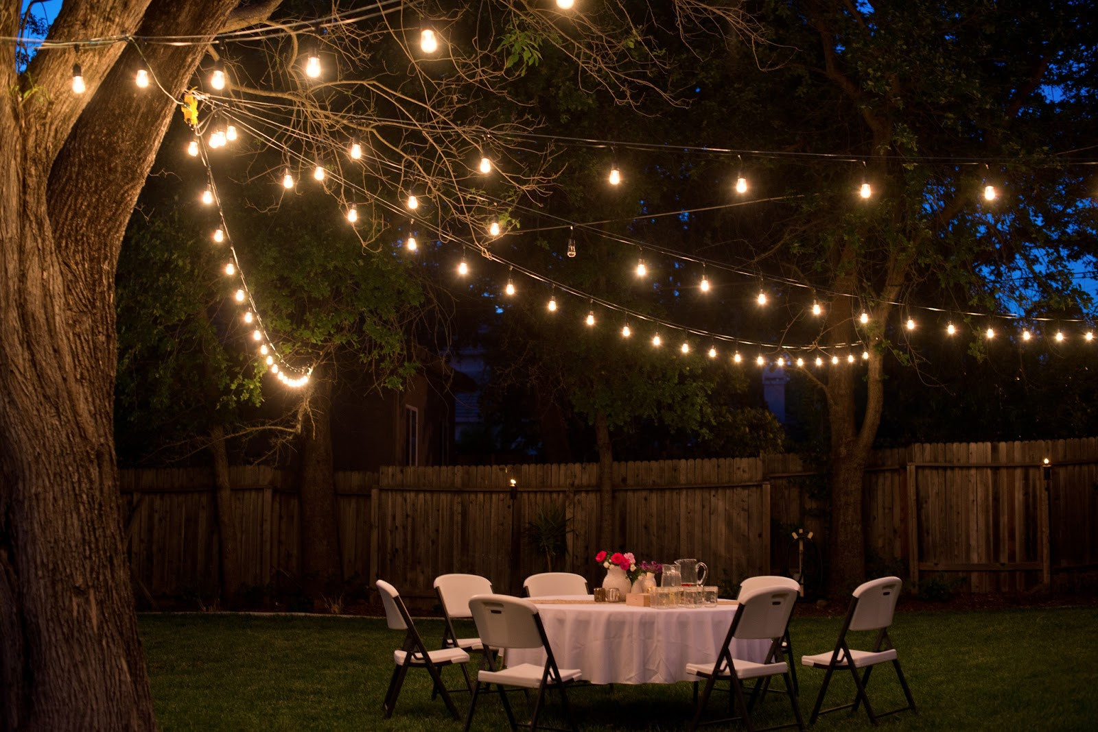 Backyard Party Ideas Lighting
 Domestic Fashionista Backyard Anniversary Dinner Party