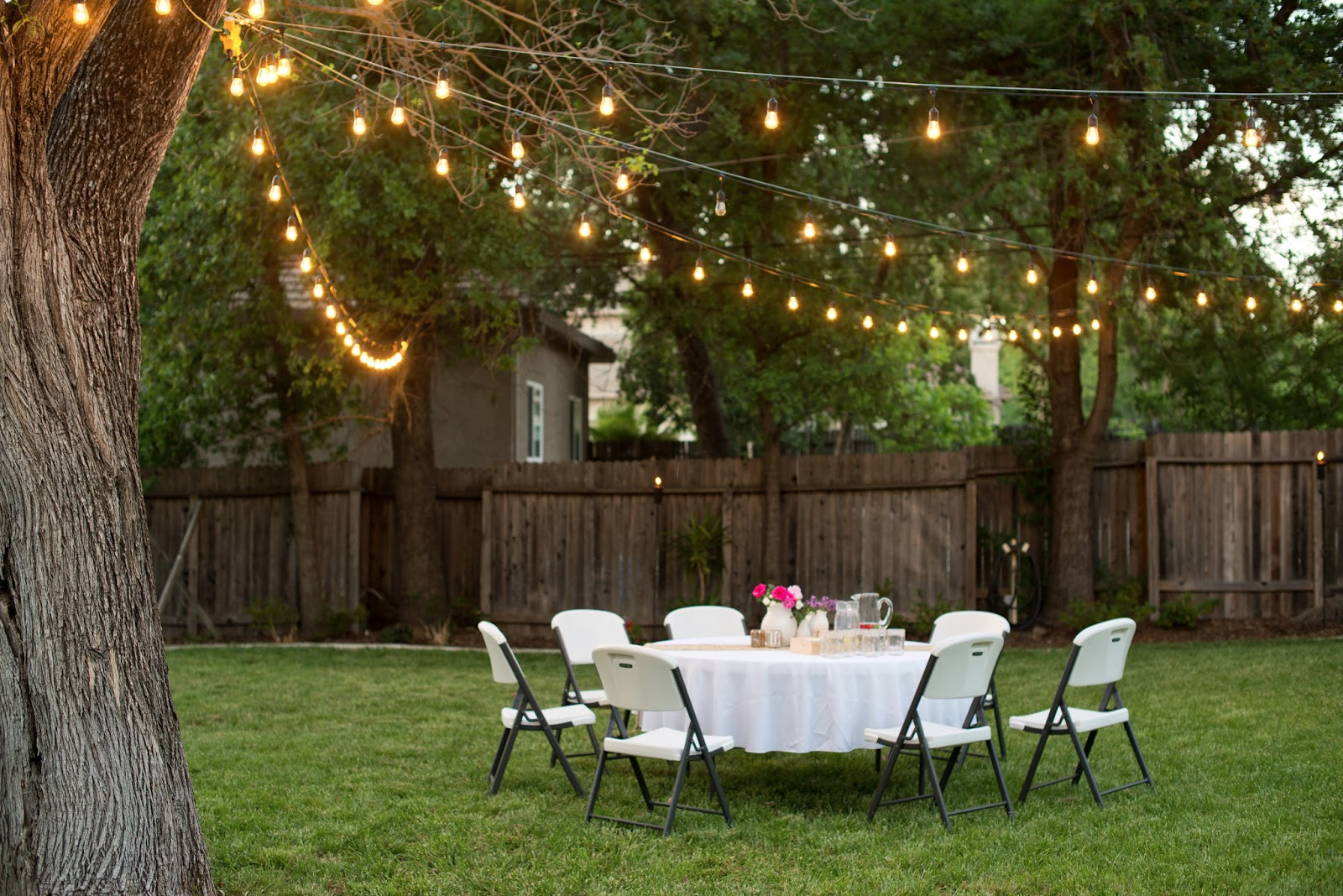 Backyard Party Ideas Lighting
 Domestic Fashionista Backyard Anniversary Dinner Party