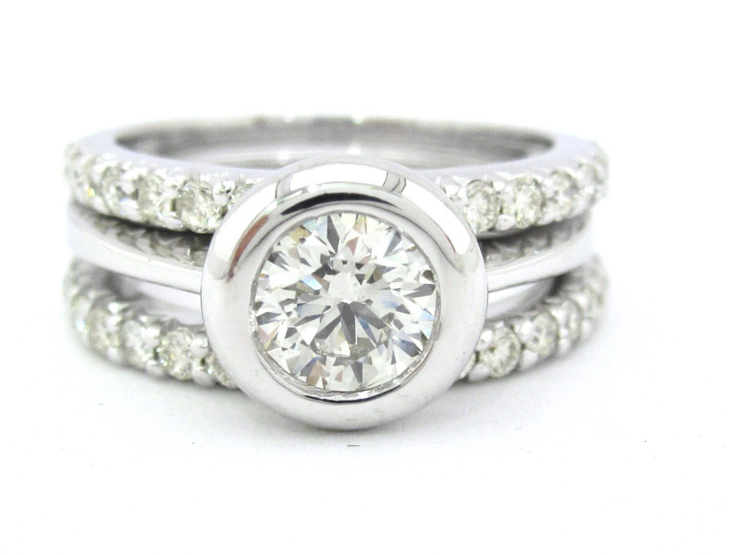 Bezel Wedding Band
 Round diamond bezel set engagement ring and bands by KNRINC