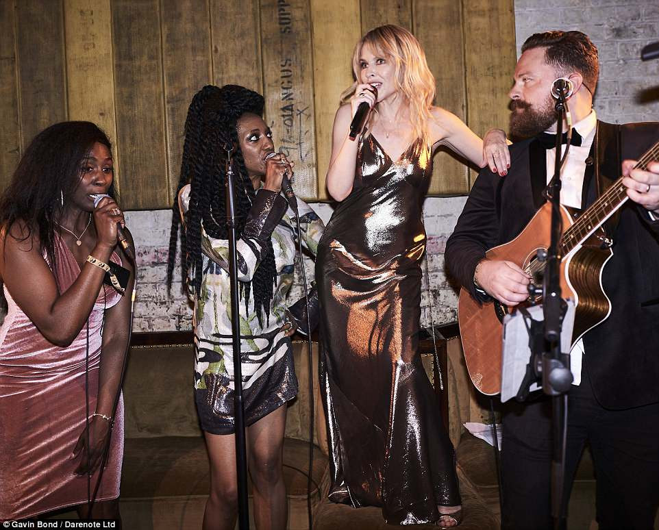Birthday Party Band
 Kylie Minogue wows in figure hugging gold dress at her