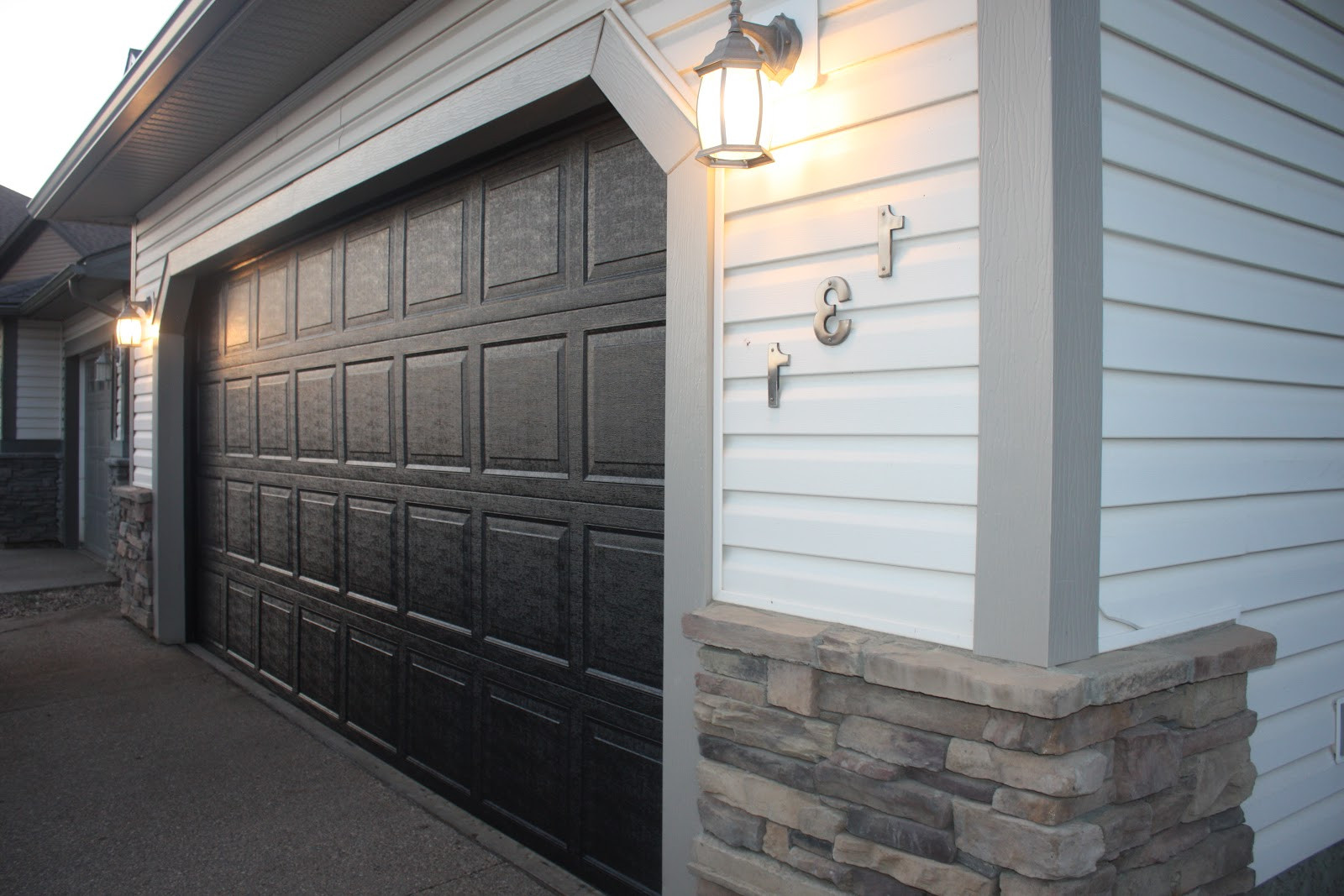Black Garage Doors
 Elegant House with Black Garage Doors Camer Design