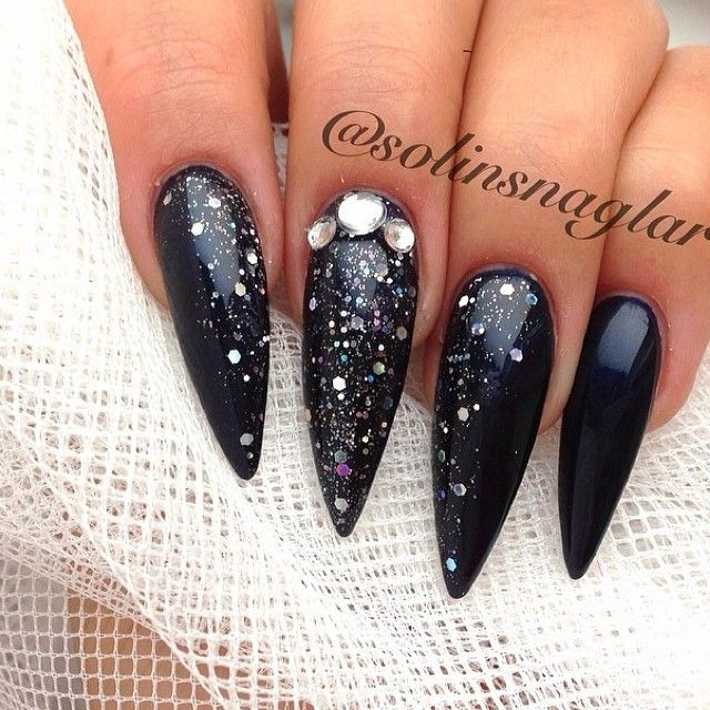 Black Glitter Stiletto Nails
 Long black with glitter stiletto nails