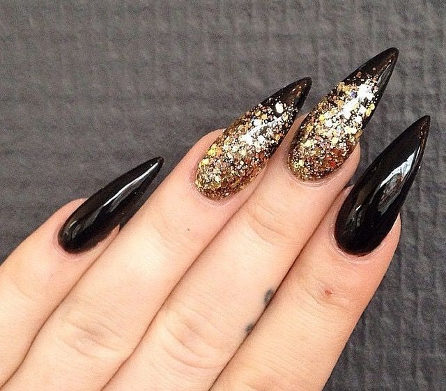 Black Glitter Stiletto Nails
 Black and gold glitter stiletto nails