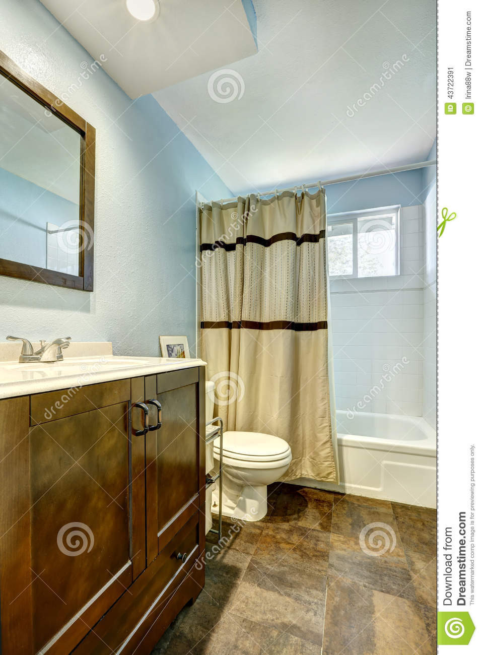 Blue Bathroom Walls
 Bathroom With Brown Tile Floor And Light Blue Walls Stock