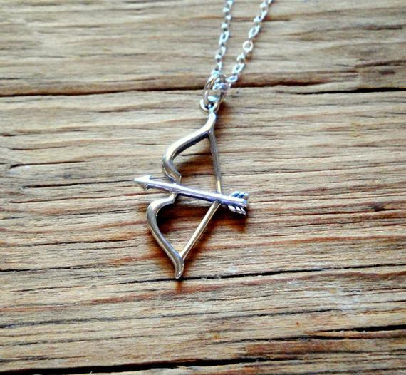 Bow And Arrow Necklace
 Sterling Silver Bow and Arrow Charm Necklace by SunbirdJewelry