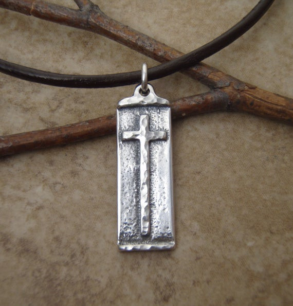 Boys Cross Necklace
 Boys cross necklace Sterling silver cross on leather cord