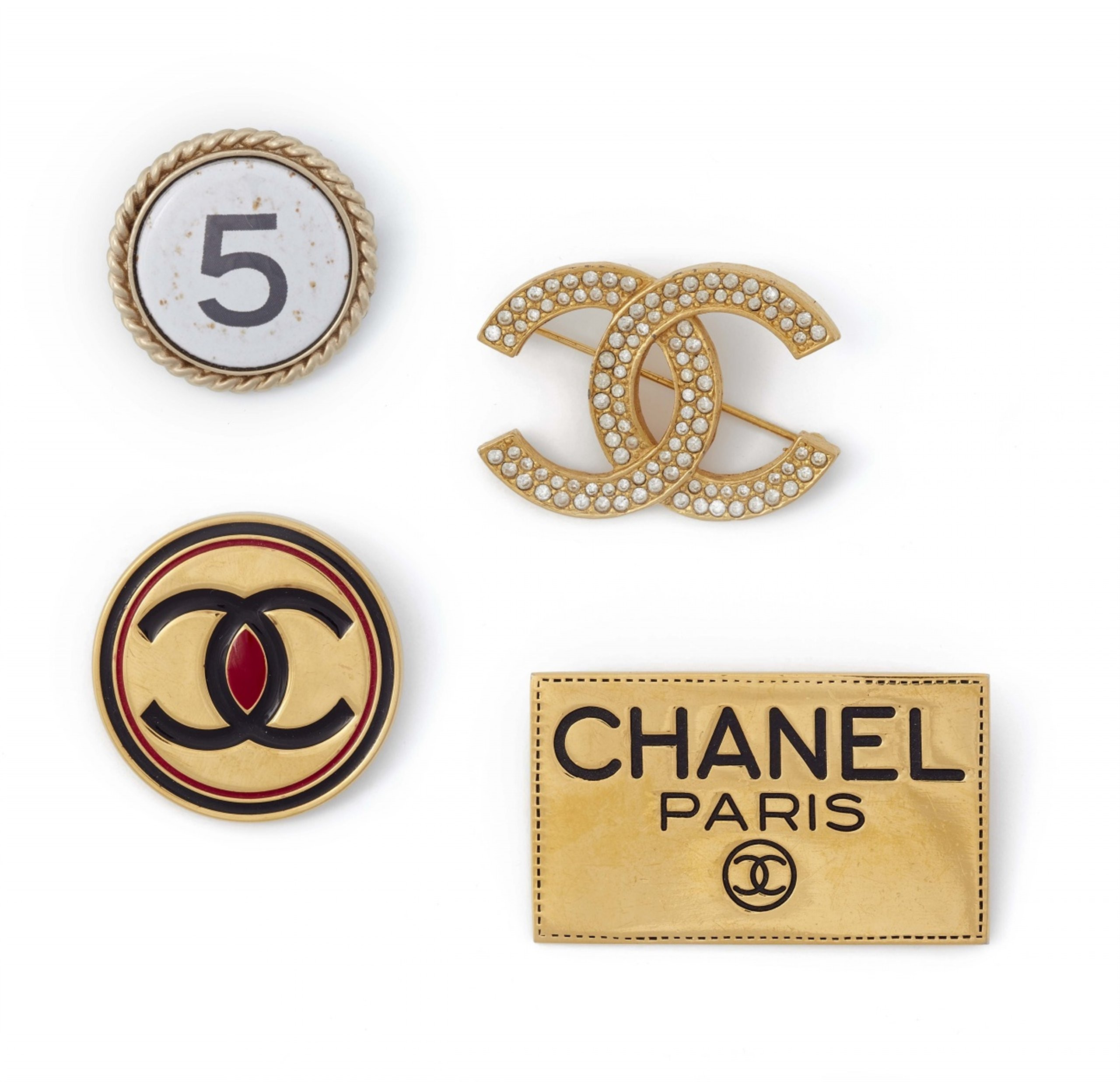 Brooches Logo
 Four Chanel logo pin brooches 1980s 2004 Auktionshaus