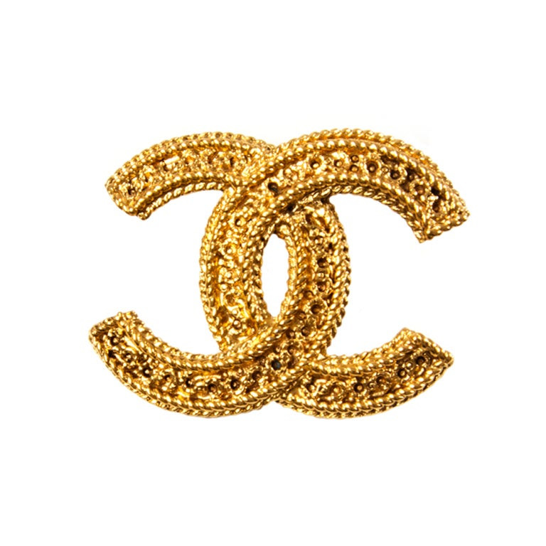 Brooches Logo
 Chanel Gold Logo Brooch at 1stdibs