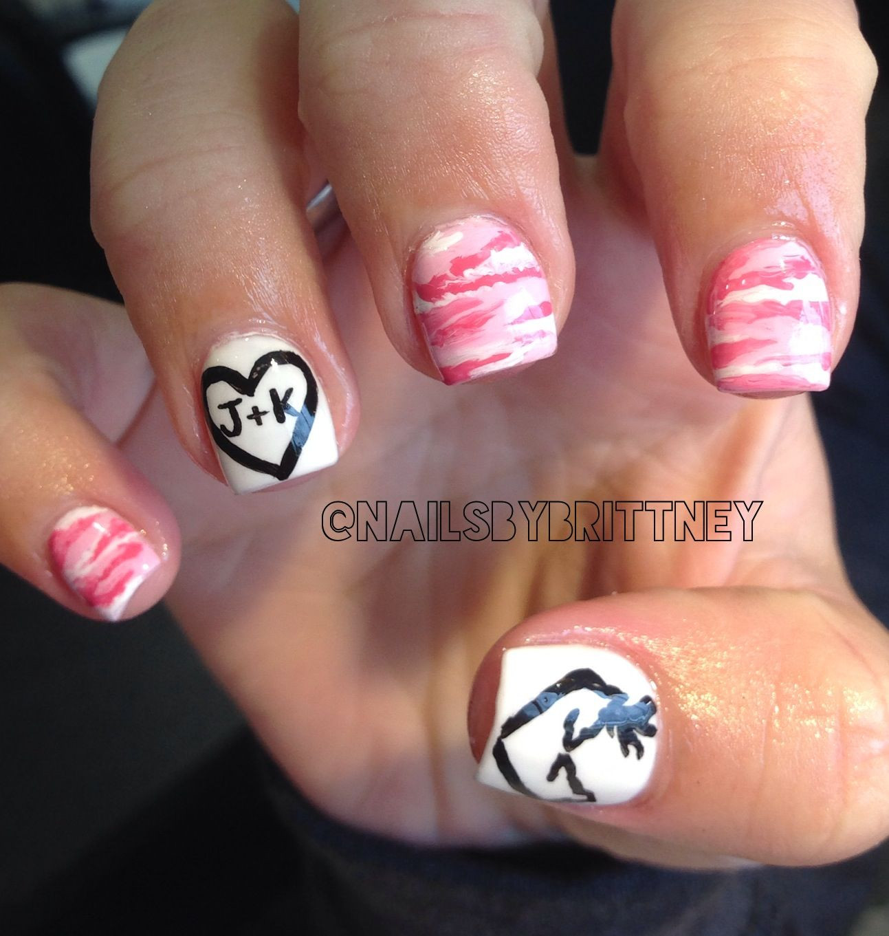 Browning Nail Designs
 Pink camo nails with browning deer symbol Nails
