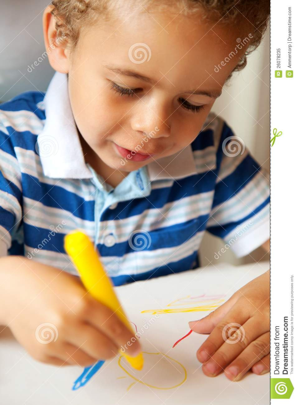 Child Coloring
 Young Child Holding A Yellow Crayon Royalty Free Stock