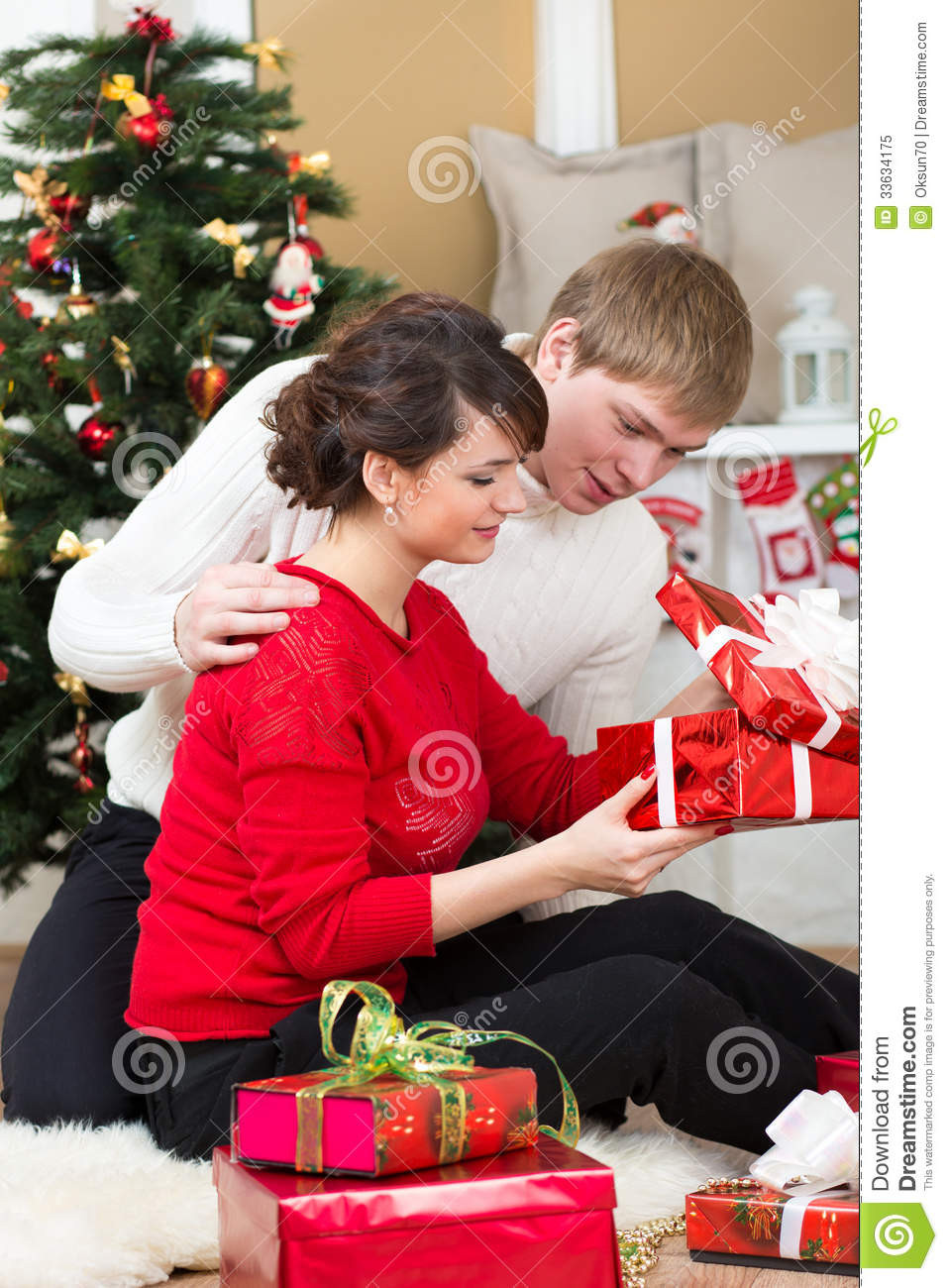 Christmas Gift Ideas For Young Couples
 Young Couple With Gifts In Front Christmas Tree Royalty