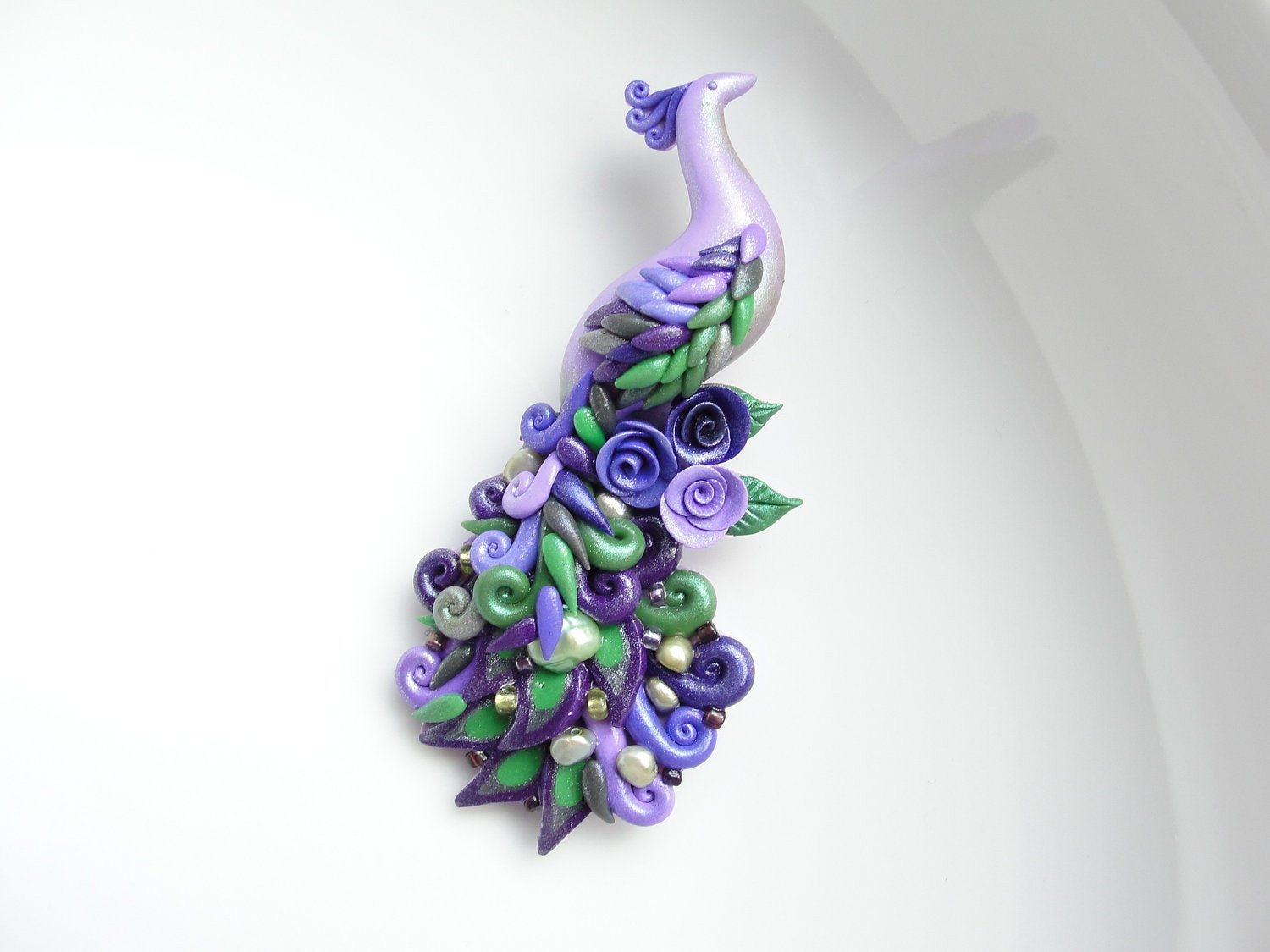 Clay Pins
 Polymer clay peacock brooch pin handmade in purple and green