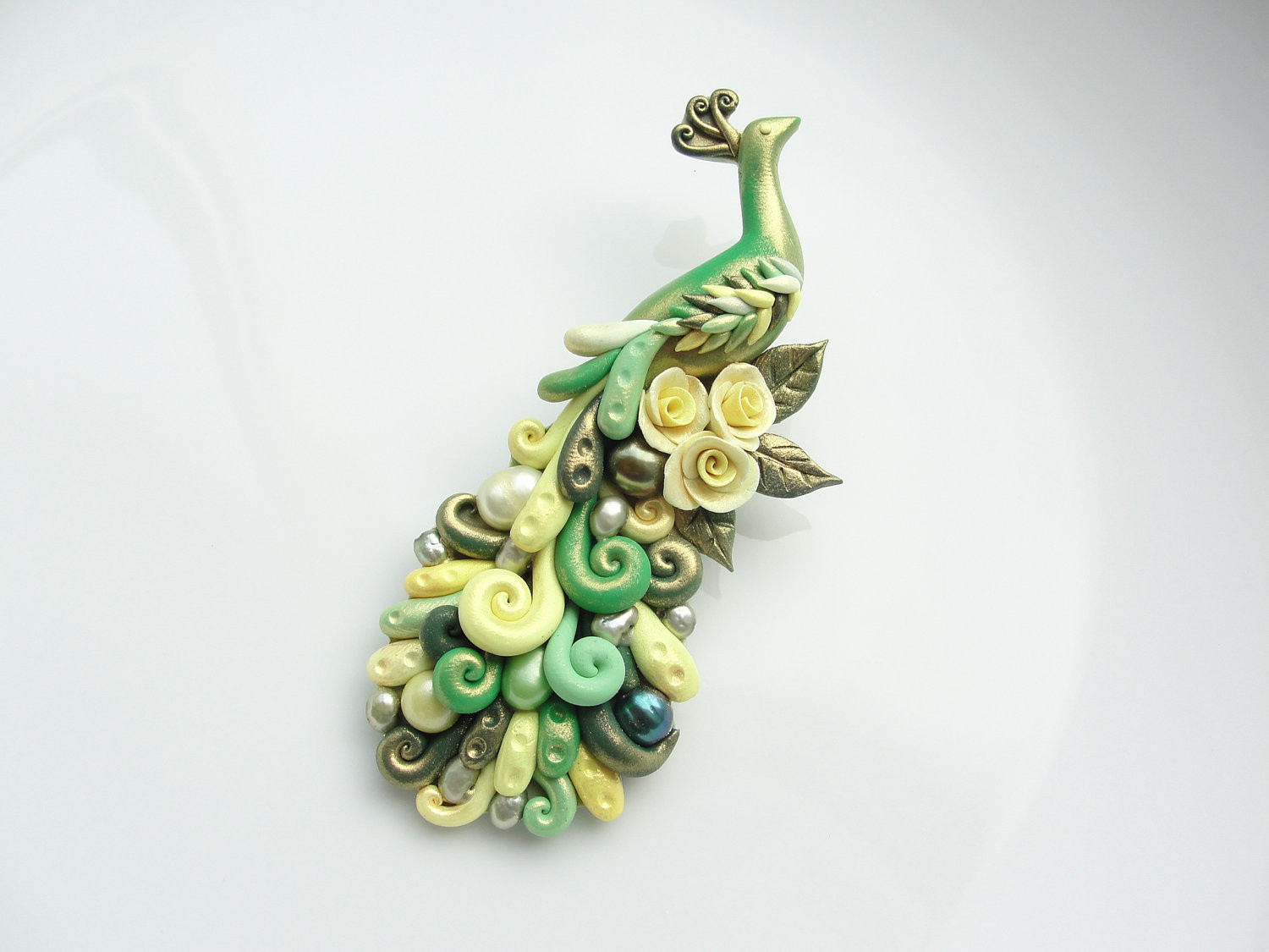 Clay Pins
 Polymer clay peacock brooch pin handmade in green and yellow