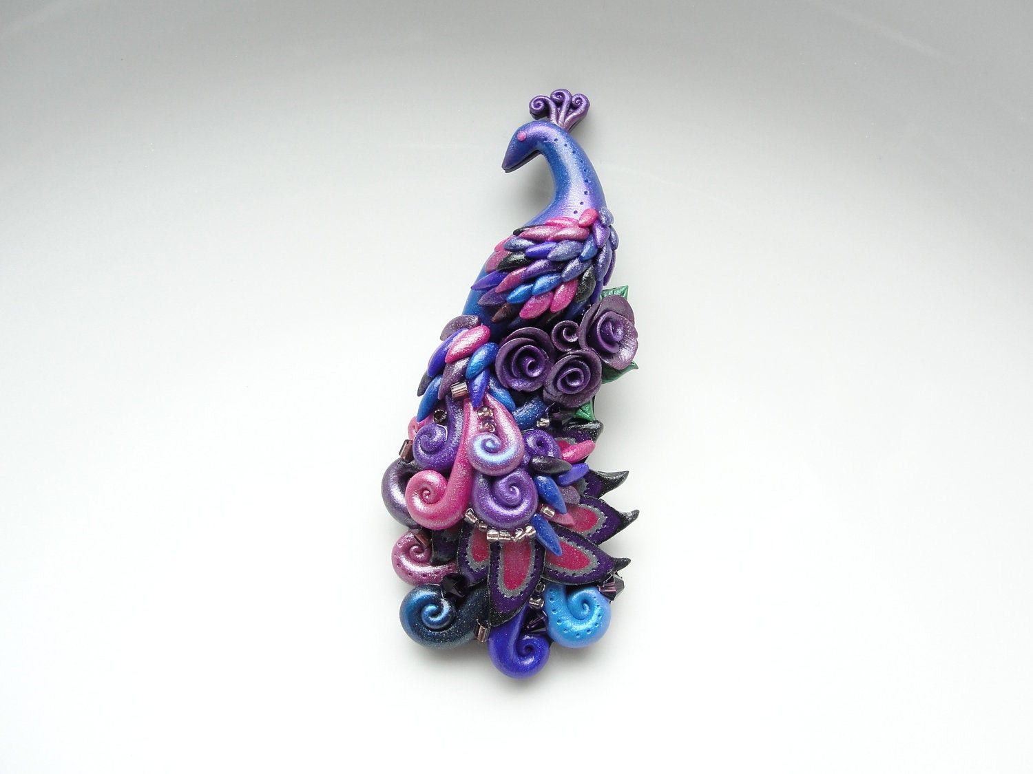 Clay Pins
 Polymer clay peacock brooch pin handmade in pink purple and