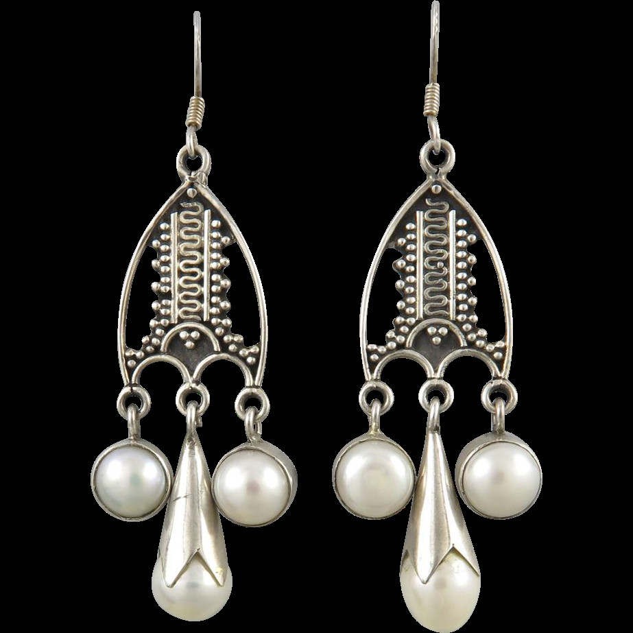 Dangling Pearl Earrings
 Sterling Silver and Cultured Pearl Dangle Earrings from