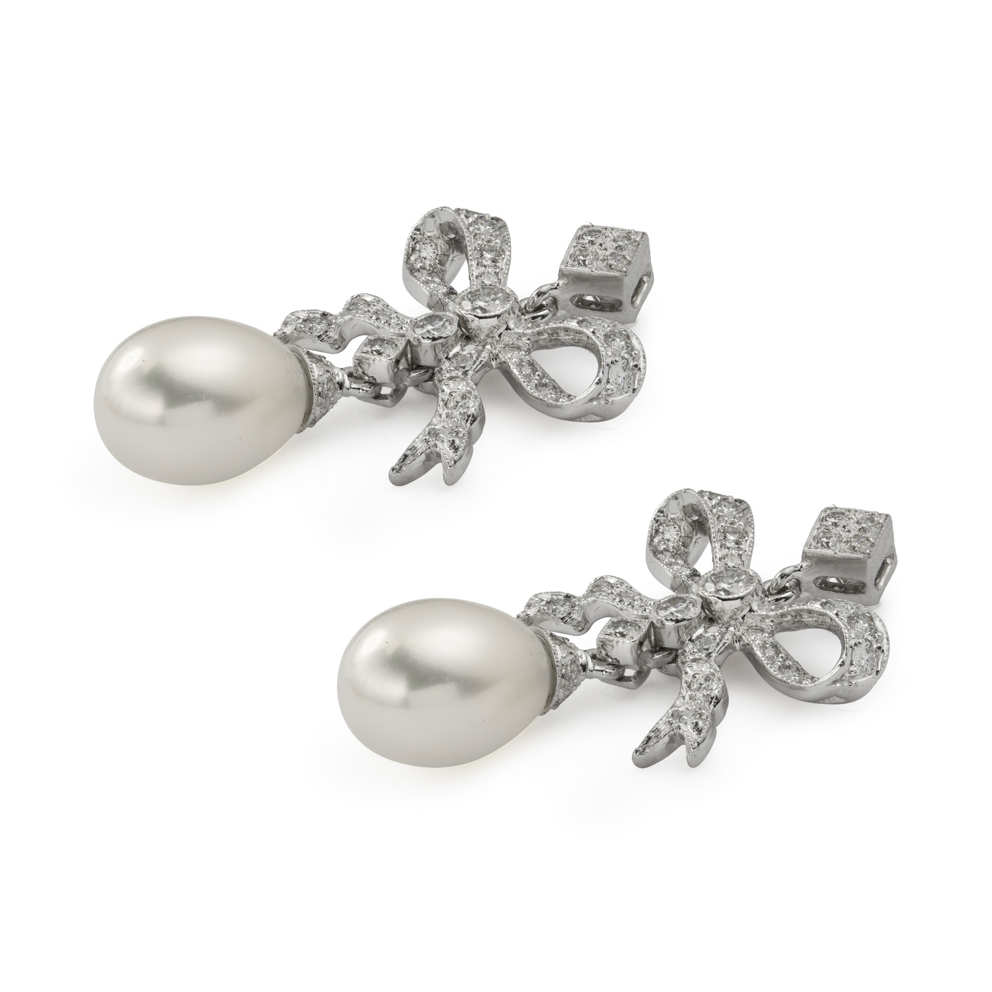 Diamond Bow Earrings
 A pair of cultured pearl and diamond bow earrings