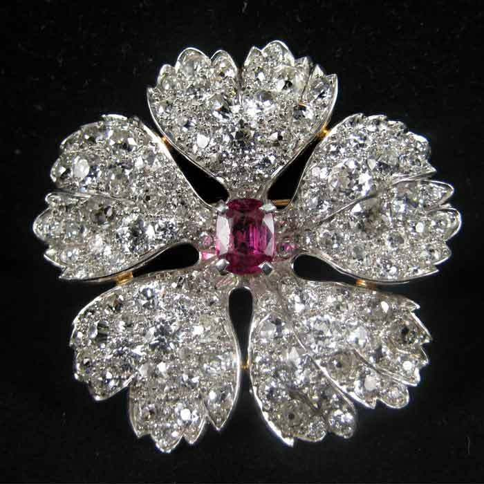 Diamond Brooches
 CARTIER DIAMOND AND RUBY FLOWER BROOCH