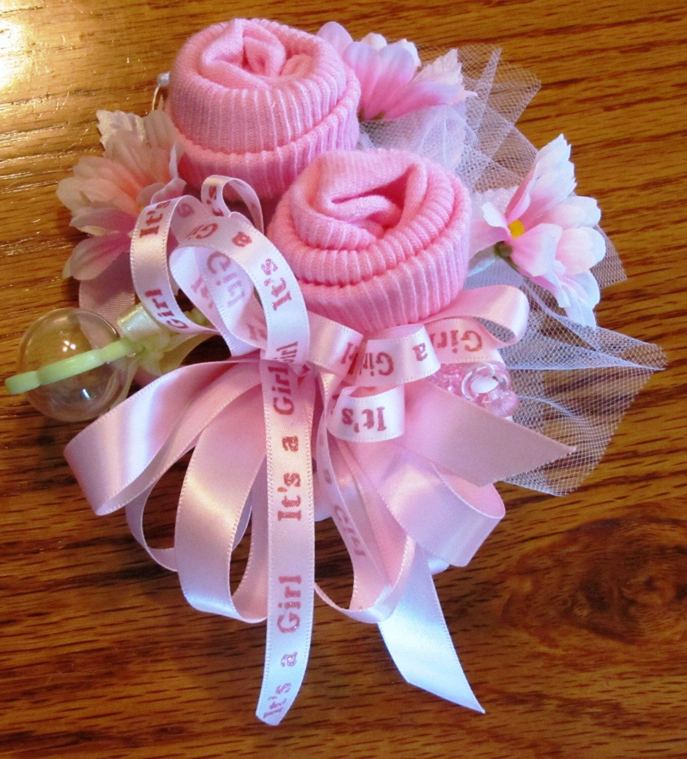 DIY Baby Shower Corsages
 Baby Sock corsage Handmade baby sock shower corsage by