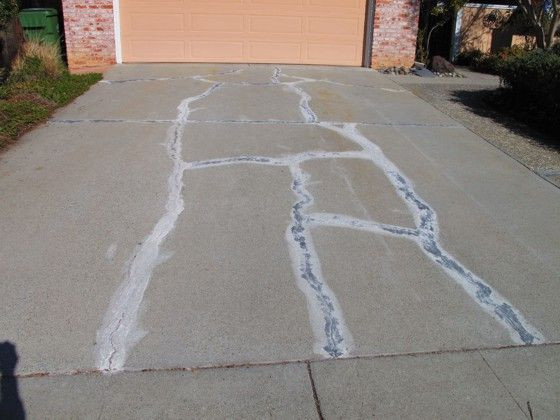 DIY Concrete Crack Repair
 This cracked concrete driveway can be made to look like