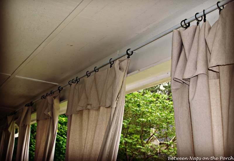 DIY Outdoor Curtains
 Drop Cloth Curtains for a Porch Add Privacy and Sun Control